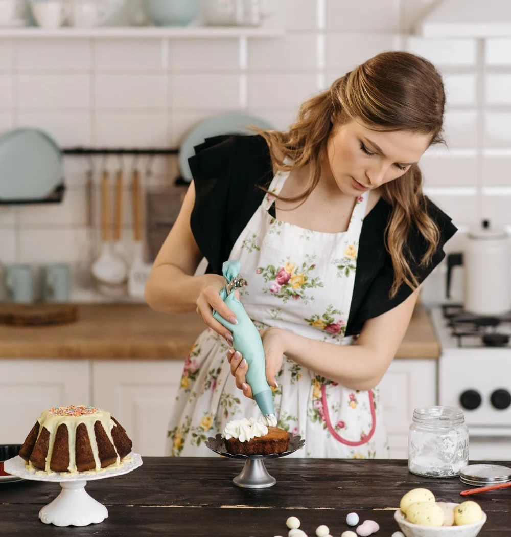 Stock illustration of a baker decorating a cake